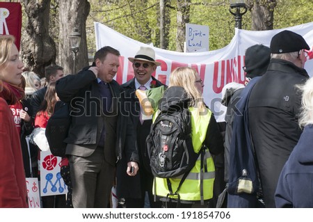 STOCKHOLM, SWEDEN - MAY 1: Parade participants are waiting for the event to start to celebrate the International Workers Day on May 1, 2014 in Humlegarden, Stockholm, Sweden.