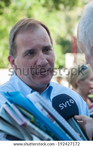 STOCKHOLM, SWEDEN - AUGUST 25: Stefan Lofven, party leader for the Swedish Social Democrats is interviewed by the press after his summer speech in Vasaparken, Stockholm, August 25, 2013.