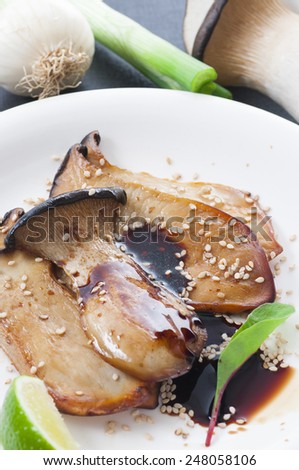 Fried sliced king oyster mushroom with olive oil, soy sauce and sesame seeds. New version.