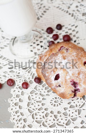 cookies in powdered sugar with cranberries and milk