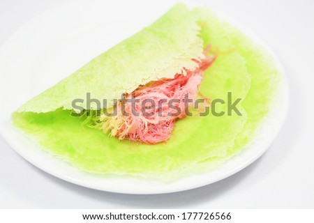 Roti Saimai (Cotton candy) is Thai-style candy floss isolated on white