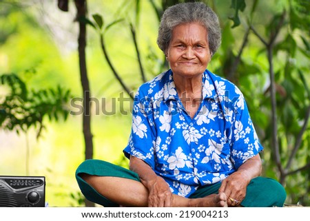 old asian woman smiling.