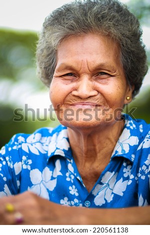 old asian woman smiling.