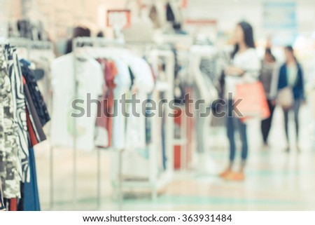 Blurred image of people in shopping mall.Vintage tone.