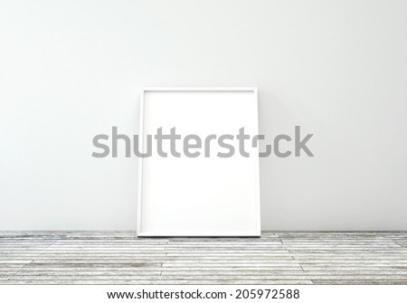 White frame on wooden floor in white interior
