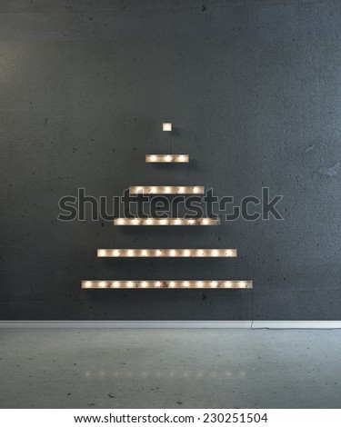 Boards with lightbulb in the form of a Christmas tree on a black wall. Happy new year and Christmas.