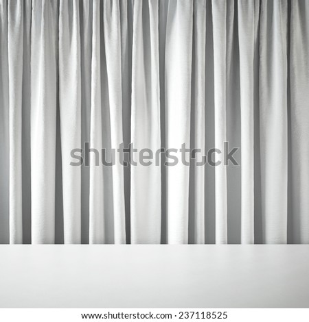 Table on background of curtains.