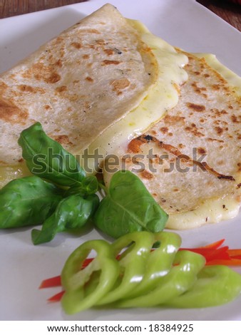 Mexican quesadillas with jalapenos and basil, in a mexican restaurant.