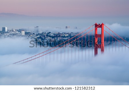 Golden Gate At Dawn Surrounded By Fog