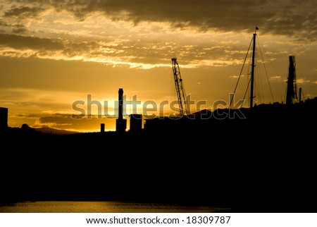 Silhouette of Imperia port at sunset