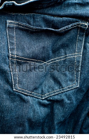 Close-up of wet and worn jeans