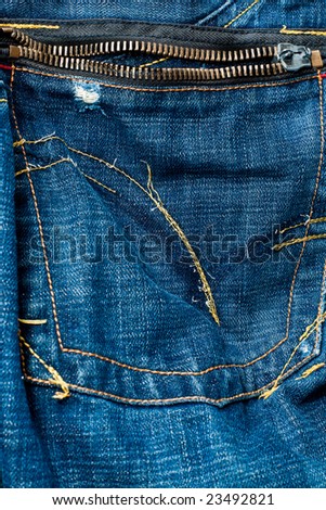 Close-up of wet and worn jeans