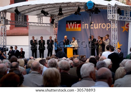 FRANKFURT - MAY 19 : Crowd listen as Angela Merkel delivers her speech for European General Elections May 19, 2009 in Frankfurt.