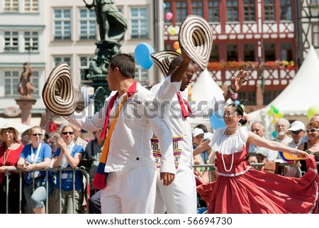 FRANKFURT - JUNE 26: Colombians dance in traditional costumes at the Parade der Kulturen. June 26, 2010 in Frankfurt, Germany.
