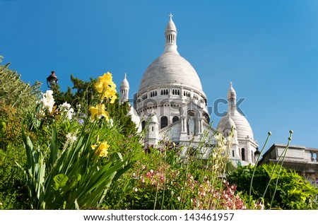 Spring flowers with Sacre Coeur Cathedral as a backdrop in Paris, France