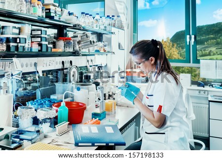 Young Scientist Works In Modern Biological Lab