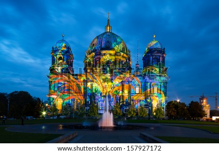 BERLIN, GERMANY - OCTOBER 12: Berliner Dome illuminated during FESTIVAL OF LIGHTS on October 12, 2013  in Berlin, Germany. This colorful show attracts many tourists and residents alike