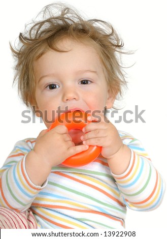 stock photo : one year old baby with brown eyes and curly hair teething on 