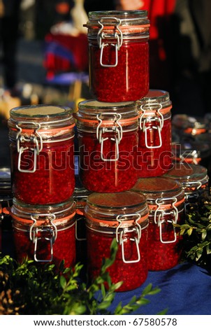 Raspberry jam jars arranged for sale