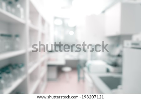 Scientific background: modern laboratory interior out of focus, text space