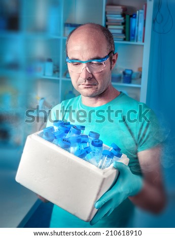 Senior scientist with medical or biological samples in white ice box