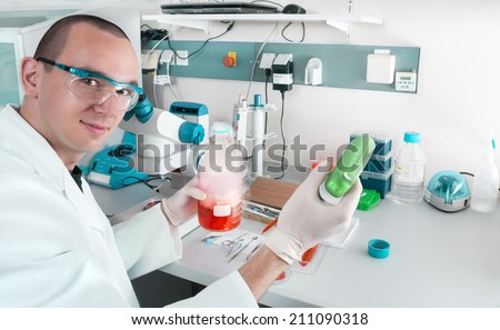 Young scientist or tech works in modern laboratory