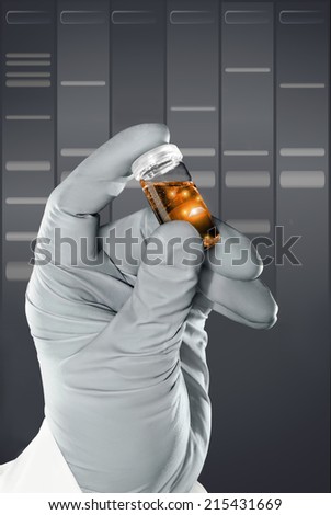 Gloved hand holds a liquid sample in plastic vial in front of DNA gel background