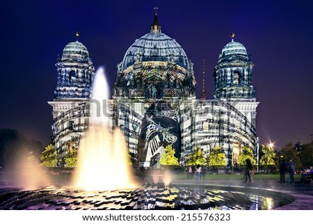 BERLIN, GERMANY - OCTOBER 14: Berliner Dome illuminated during FESTIVAL OF LIGHTS on October 14, 2013  in Berlin, Germany. This colorful show attracts many tourists and residents alike