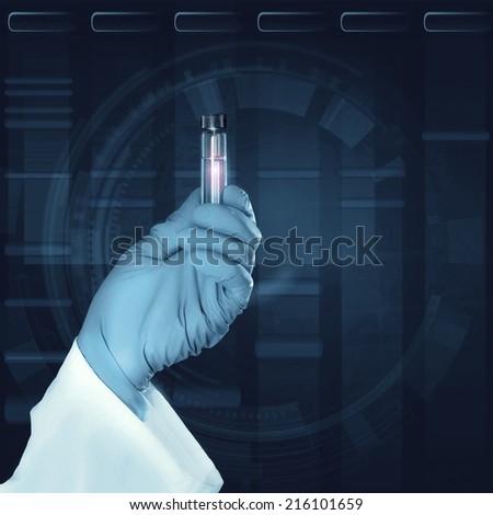Gloved hand holds a liquid sample in plastic tube in front of dark scientific background