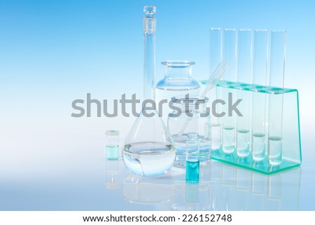 Scientific background with chemical flasks and tubes, space for your text
