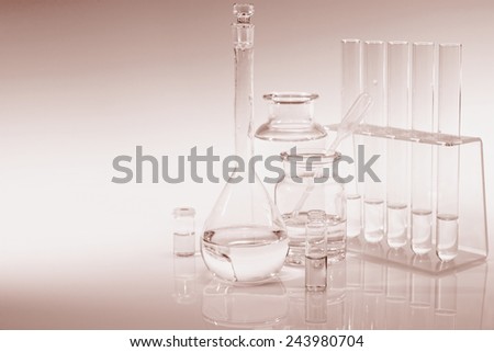 Scientific background with chemical glass, flask and tubes, sepia toning