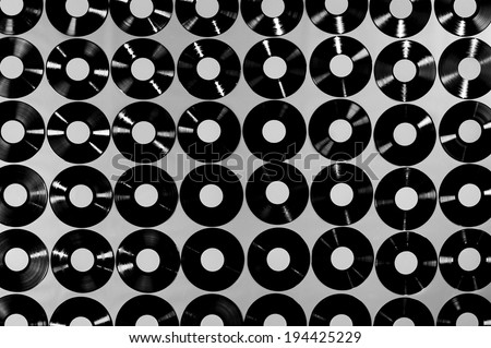 Music - Vinyl records. Collection of vinyl records, LPs, black and white image, top view. The labels can be easily customized, the image is suitable for background use.