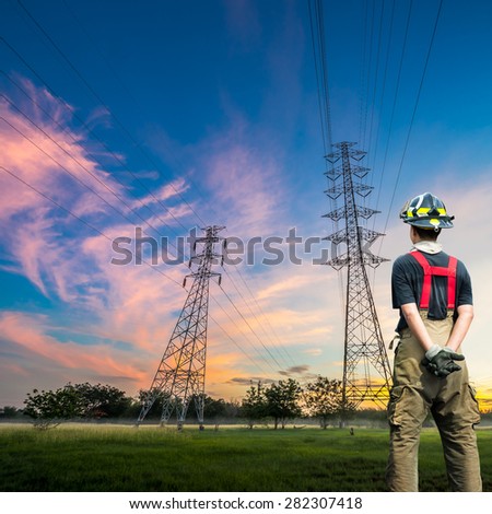Engineer safety survey of the electricity pylon on sunrise time