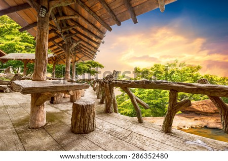 Wooden porch at the natural view point upon the mountain in sunset time