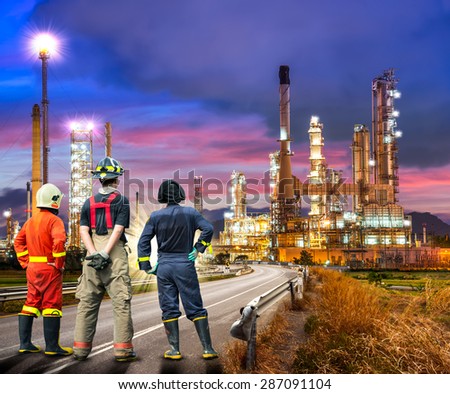 Engineer team in uniform are safety survey of the oil refiner industry
