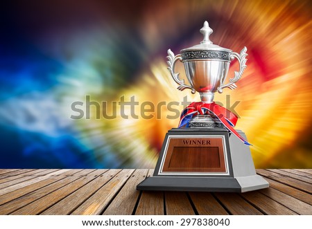 Winner trophy on wooden table for the champion of sport competition