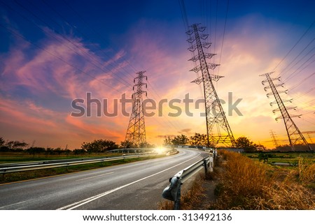 Height voltage electricity pylon system on sunrise background
