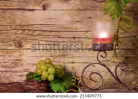 Candle holder with vine leaves