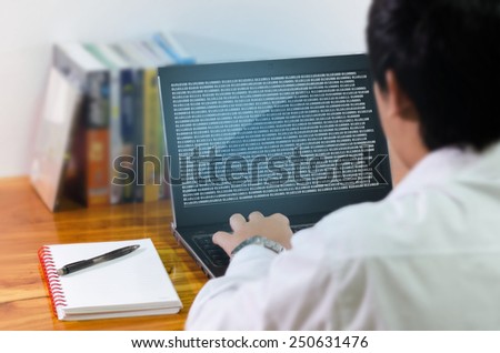 Programmer coding in the computer.