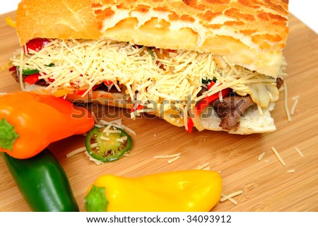 Steak and Sweet Pepper Sandwich with mild jalapeno chili and grated asiago cheese
