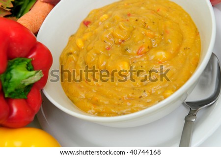 Hot vegetable soup for a fall day with fresh vegetables on the side.