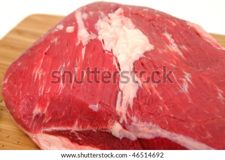 Fresh raw tri-tip roast with fat marbled through the meat ready to roast or barbecue