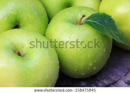 Green apple with apple Green Background, water drop.