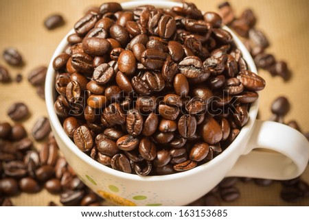 roasted coffee seed coffee cup background