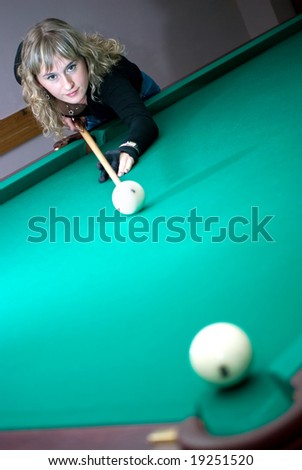 The girl beat the ball into a billiard pocket