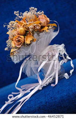 stock photo The dried up wedding bouquet on a dark blue background