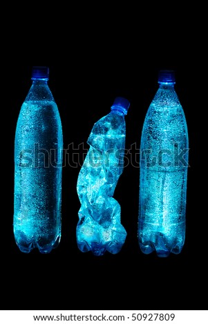 Three bottles with mineral water. Isolate on black