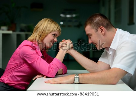 armwrestling in the office. girl vs guy