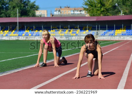 Girls athletics stadium. Preparing to run