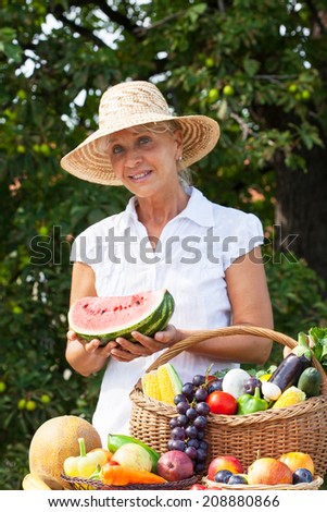 Adult woman with fresh local organic products